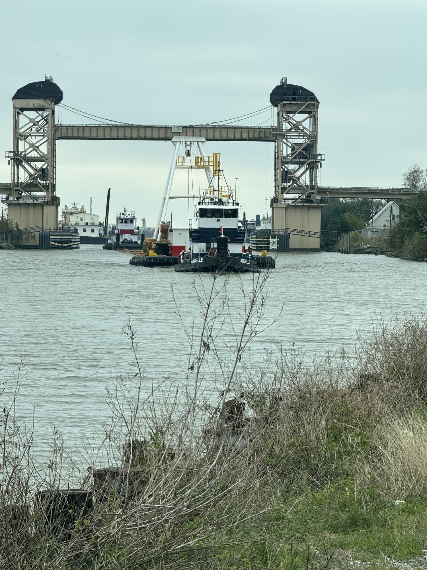 Melancon Marine workboats passing the lift bridge on Bayou Lafourche